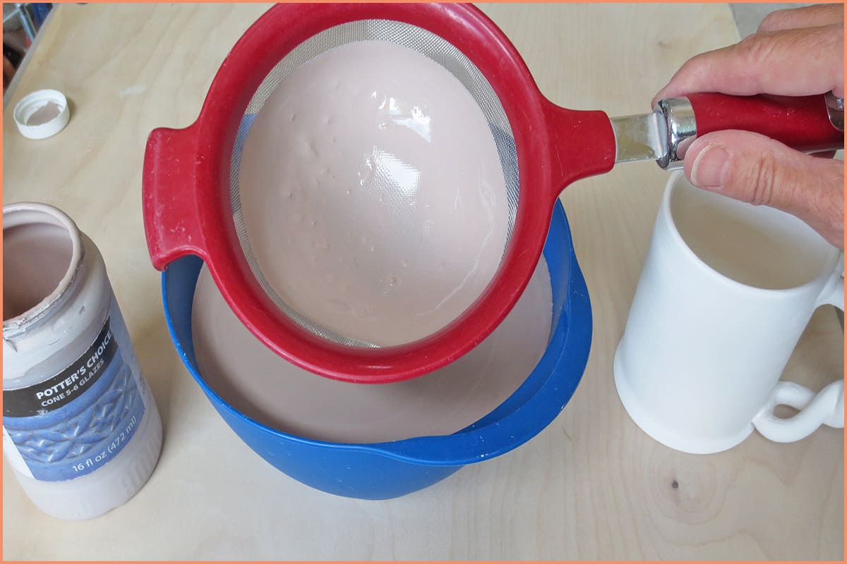 a picture of a potter running glaze through a strainer