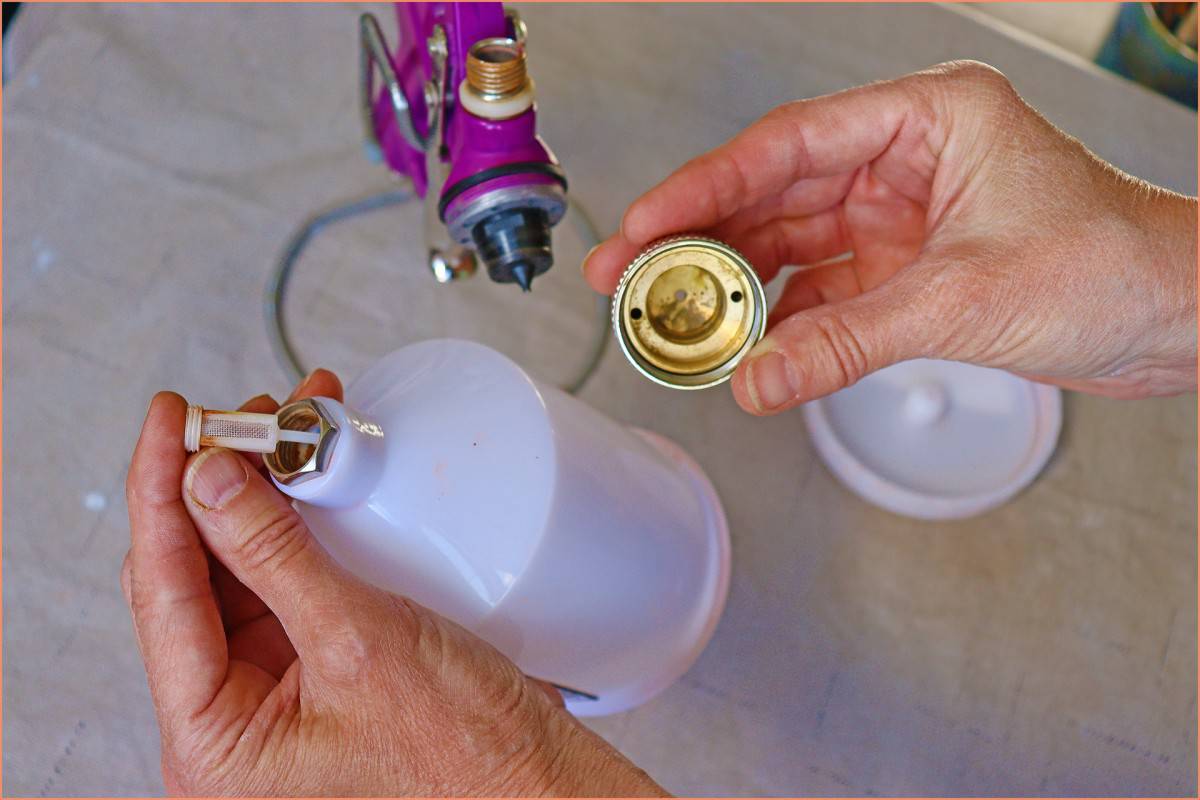 a picture of a potter showing where to clean spray gun