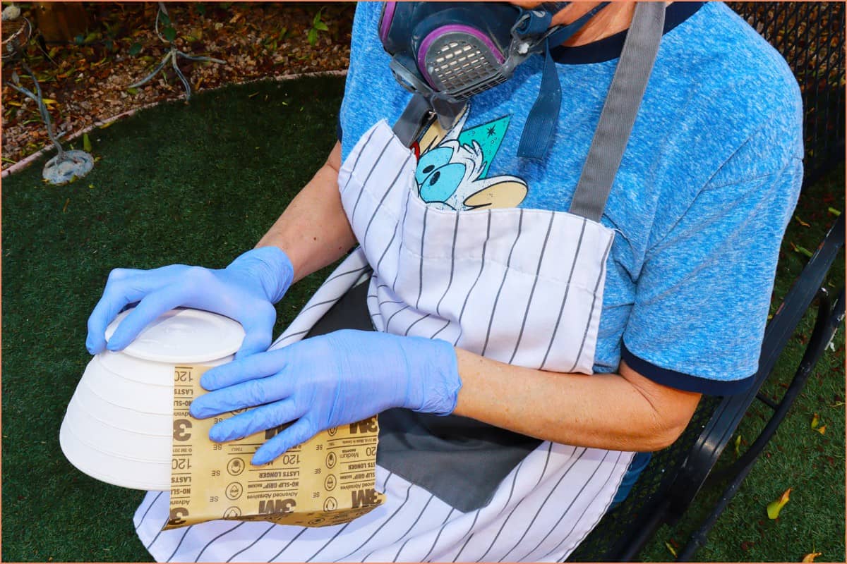 image of a potter Sanding your Pottery