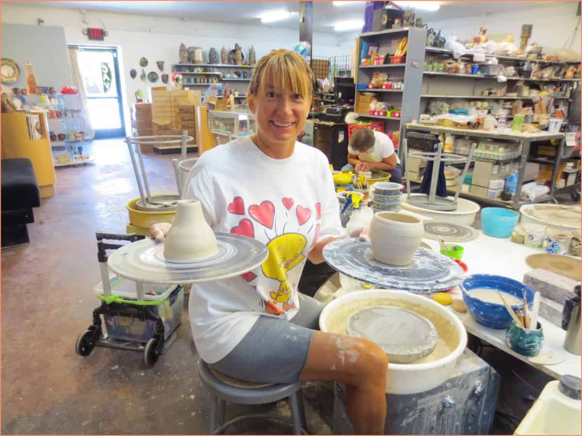 Online vs In-Person Pottery Classes - A Beginners Guide image of potter in studio