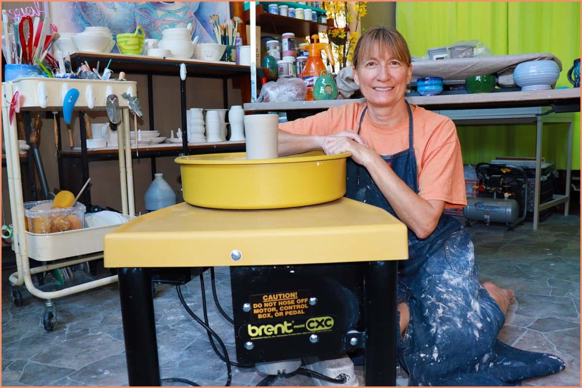 a picture of a potter at the wheel