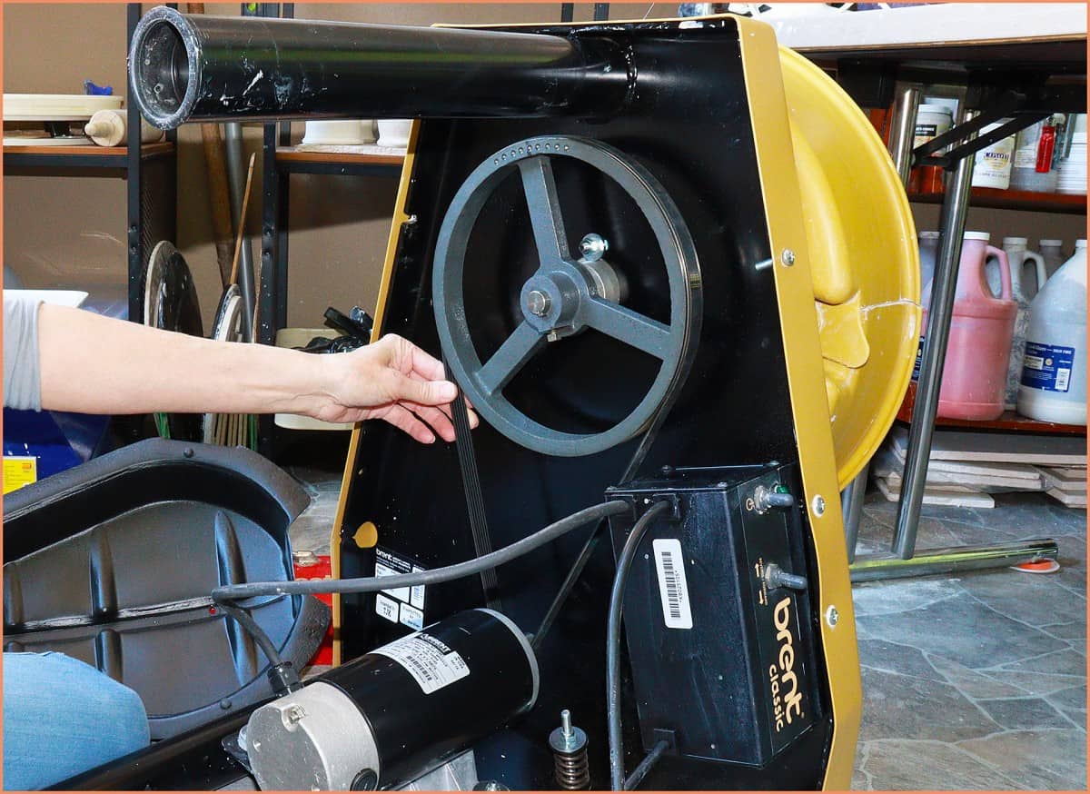 a picture of a potter with a wheel belt