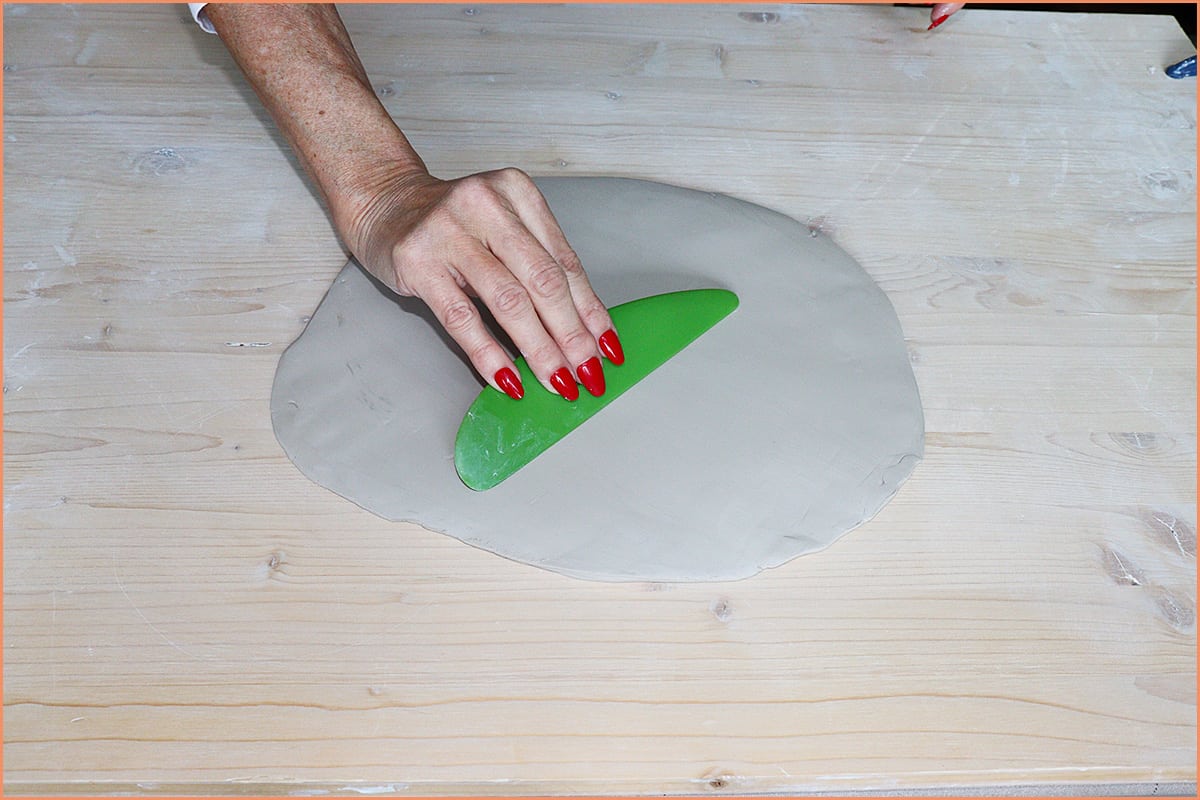 Using a plastic rib to compress the clay 1 1
