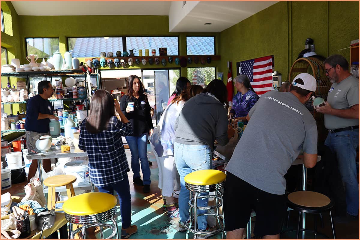 Online vs In-Person Pottery Classes - A Beginners Guide an image of a pottery class