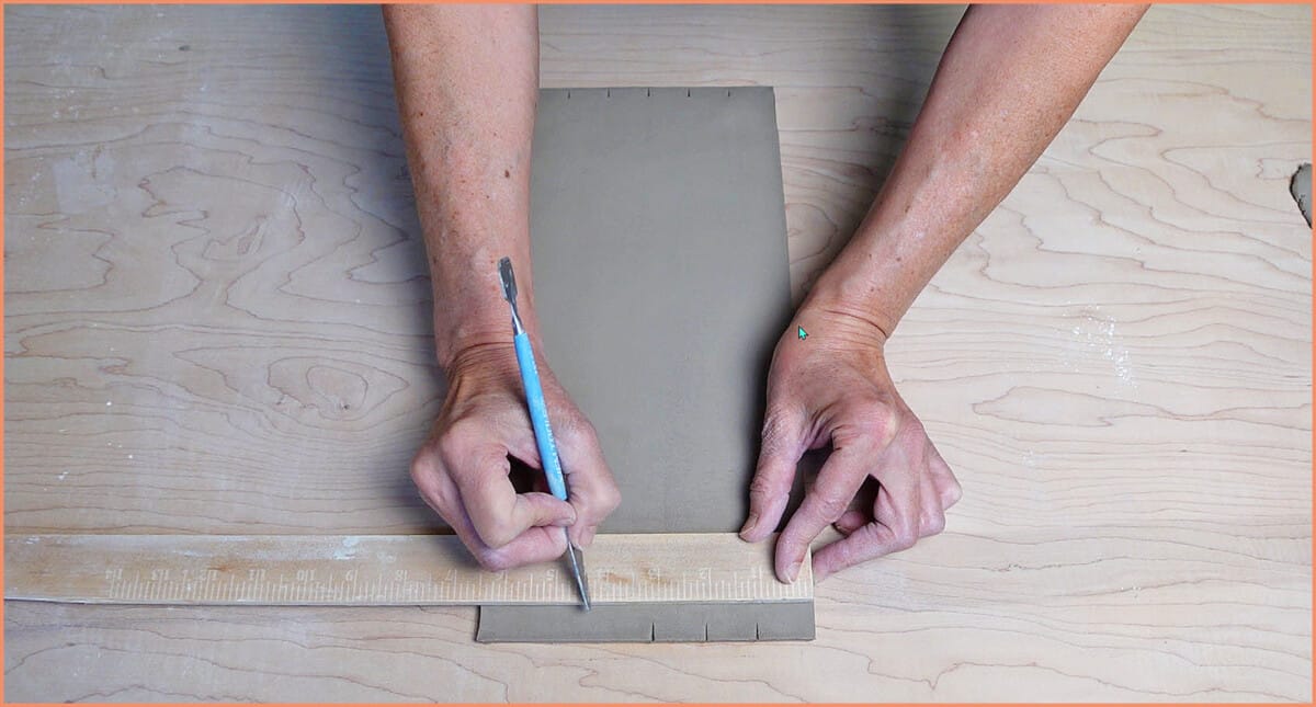 marking clay with ruler