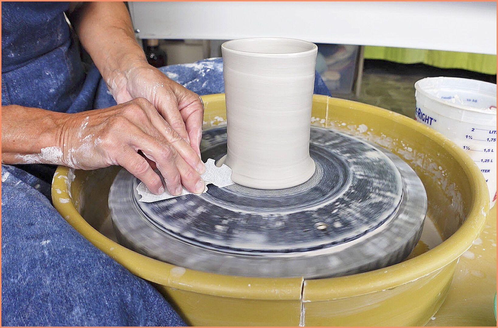 an image of making a lip on a clay pot with the Ultimate Edger pottery tool