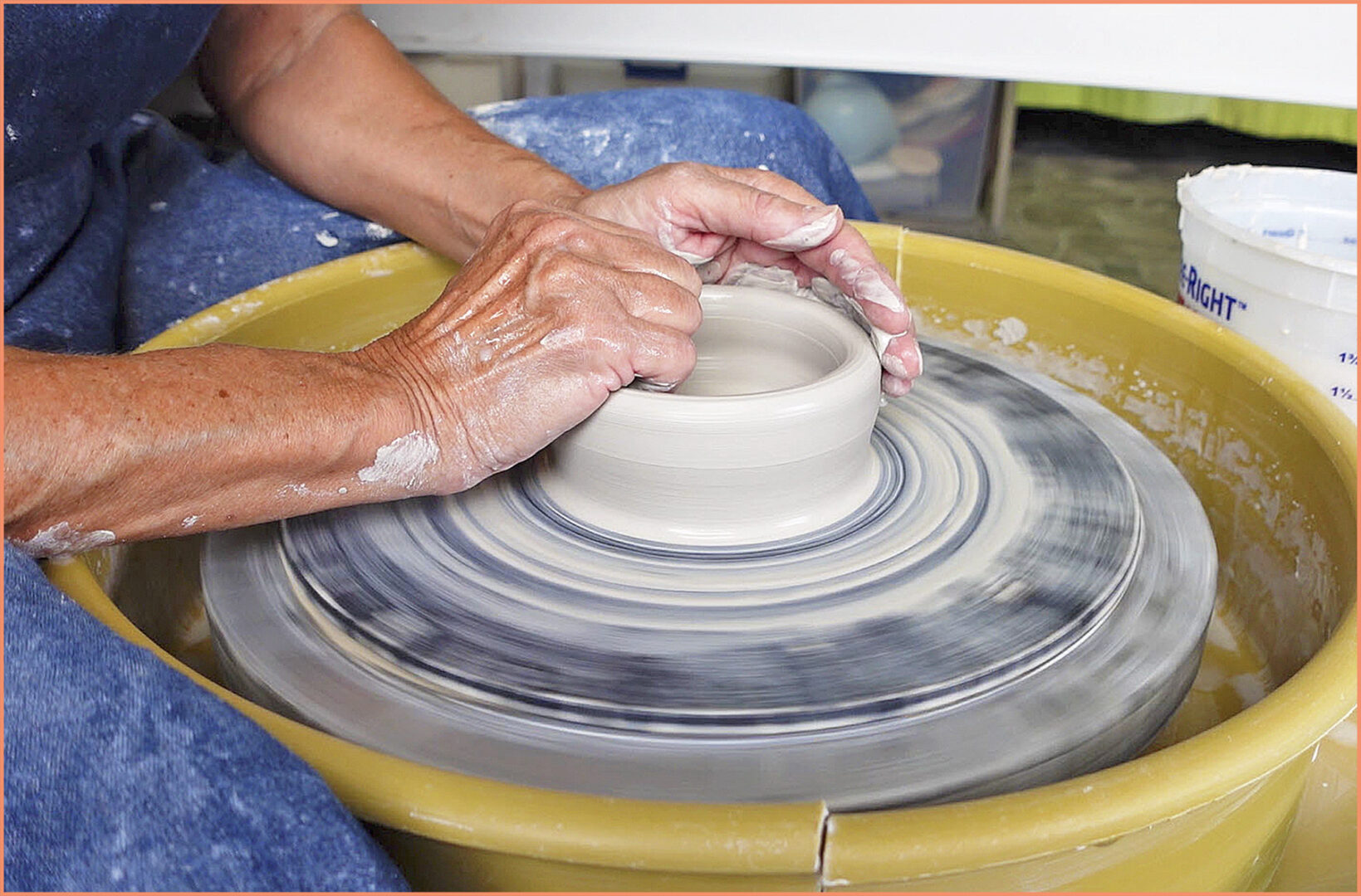 an image of a potter pulling up the walls using the crabs claw